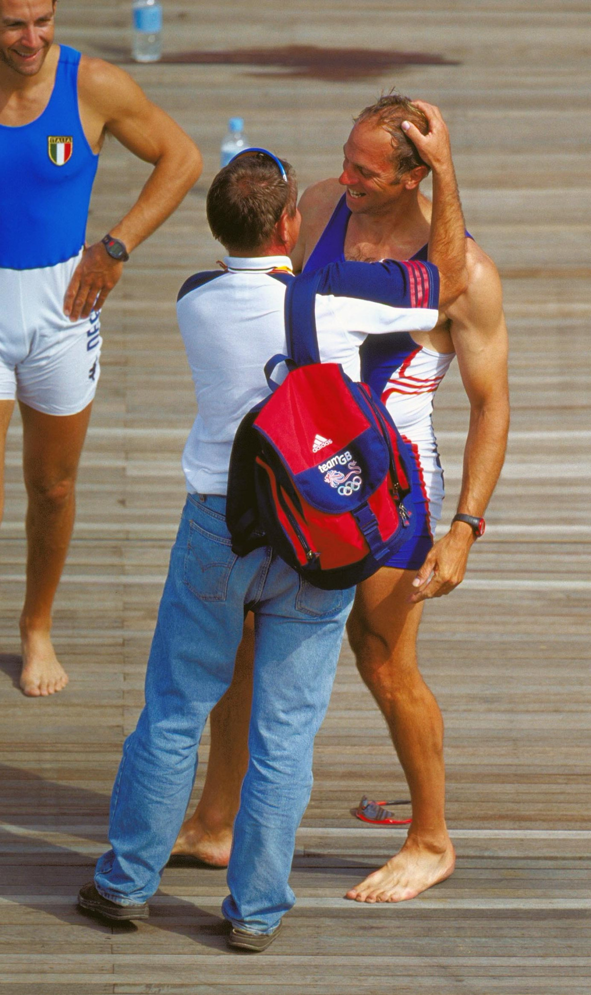 Jürgen Grobler congratulates Steve Redgrave after he won the fifth Olympic gold of his career at the Sydney 2000 Games despite having to manage colitis and diabetes ©Getty Images   