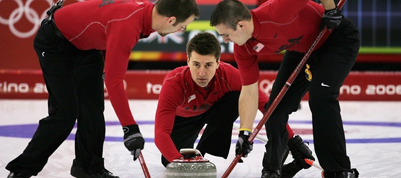 Pete Fenson, centre, was the skip when the United States won its first-ever Olympic curling medal - a bronze at Turin 2006 ©Getty Images