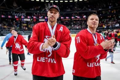 Dainius Zubrus, left, new President of the Lithuanian ice hockey federation, and team-mate Darius Kasparaitis pictured after helping their nation to promotion to the IIHF World Championship Division One Group A ©IIHF