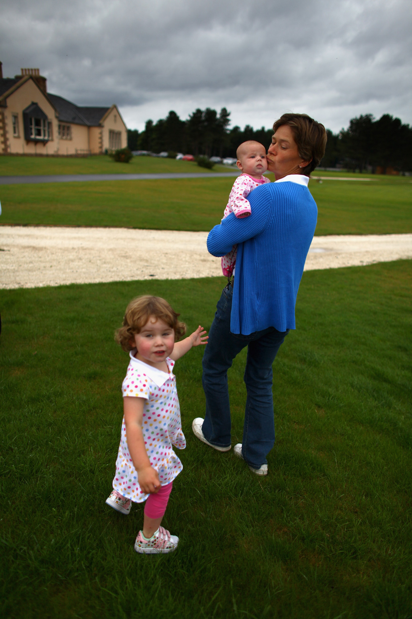 Britain's Catriona Matthew celebrates with her daughters after her success at the Women's British Open at Royal Lytham and St. Annes  in 2009 only two months after giving birth ©Getty Images