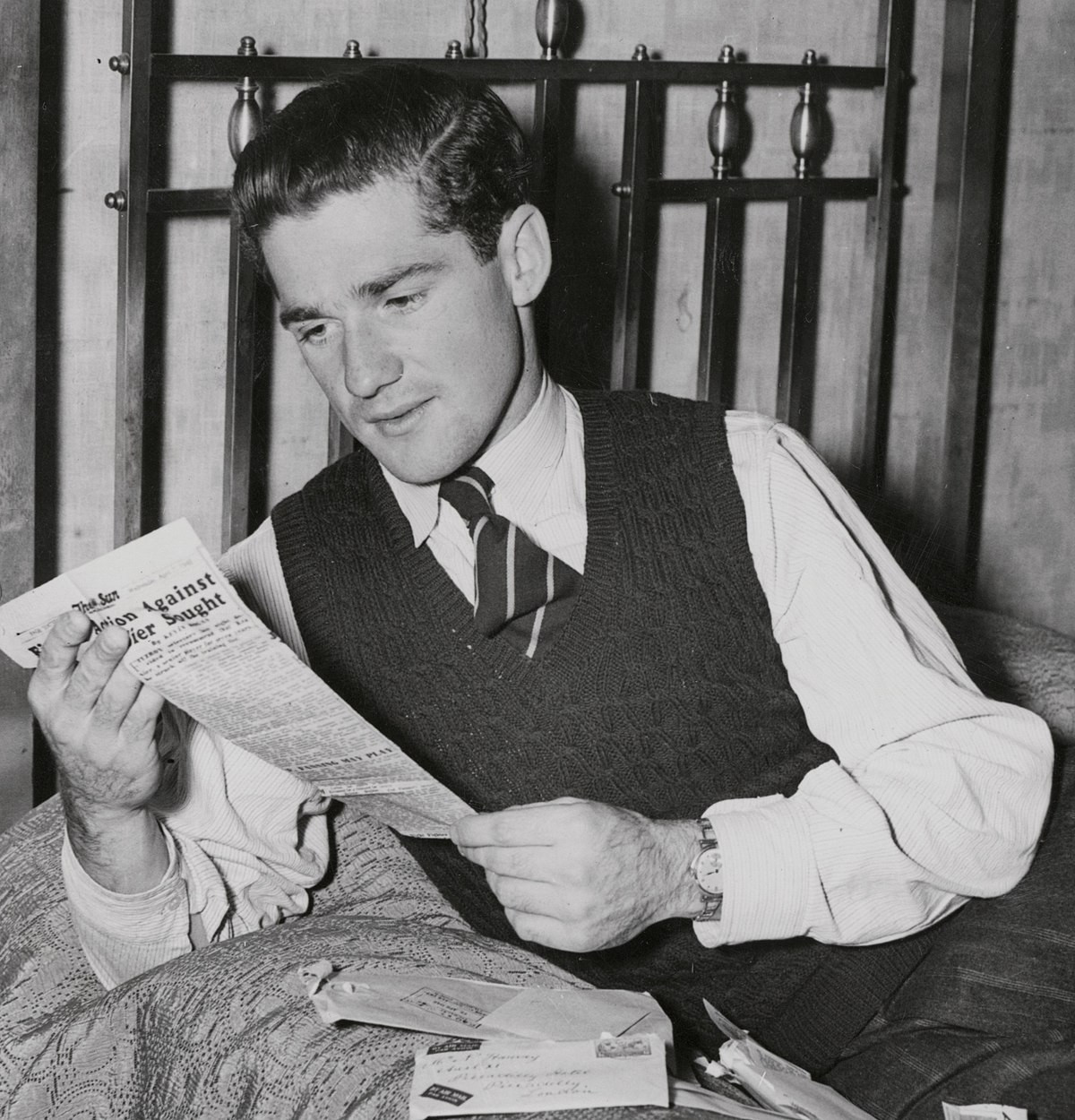 Teenager Neil Harvey reads what the media were writing about him after he scored 112 runs against England ©Getty Images