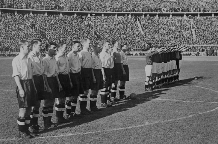 England's football players will shortly follow the German lead of a Nazi salute before their 1938 match at Berlin's Olympic Stadium ©Getty Images  