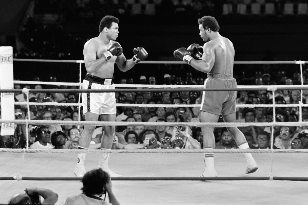 George Foreman, right, pictured en-route to losing his world heavyweight title to Mohammed Ali in the Rumble in the Jungle, returned to win world titles aged 45 ©Getty Images