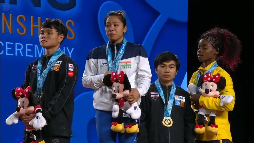 India's Mirabai Chanu, centre, hopes to recover from injury in time to compete in Ashgabat in November and defend the IWF World Championships title she won in Anaheim last year ©YouTube