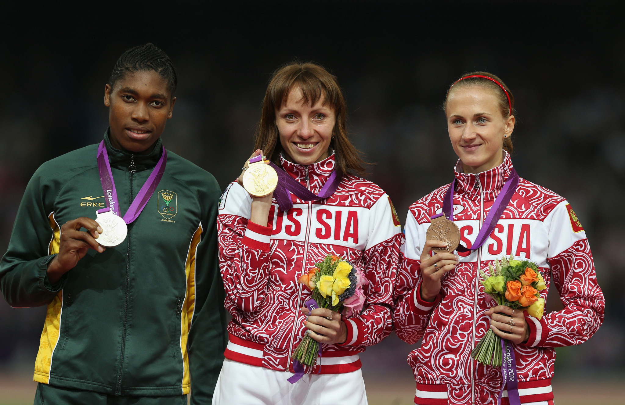 Mariya Savinova, centre, pictured receiving her London 2012 gold medal ©Getty Images