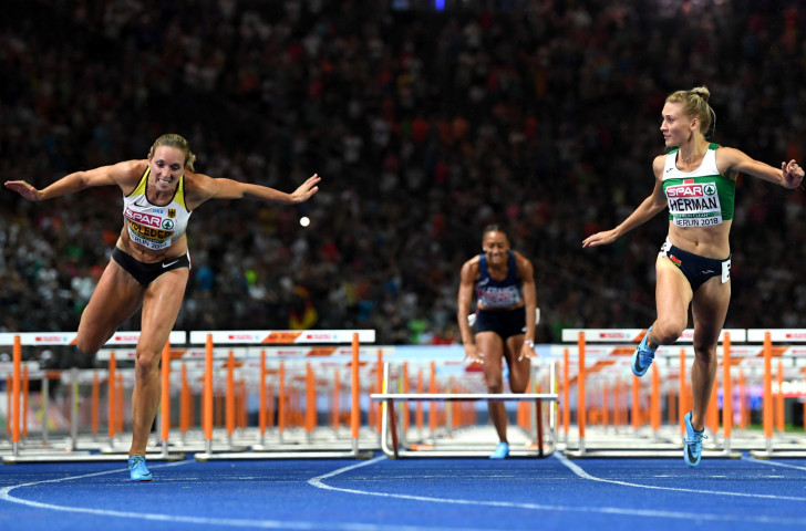 Elvira Herman of Belarus, right, wins the European title in the 100m hurdles ©Getty Images  
