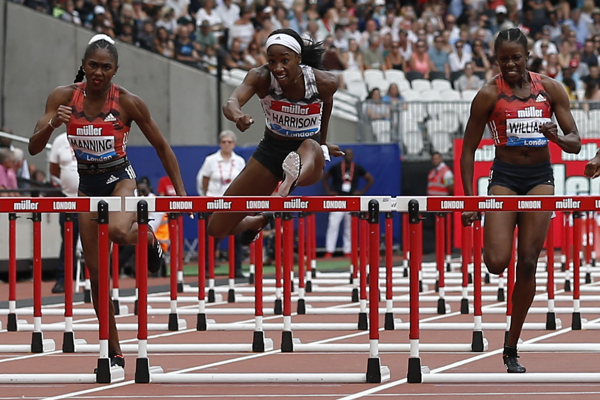 The United States' Kendra Harrison, centre, set a new championship record in the women's 100m hurdles ©Getty Images