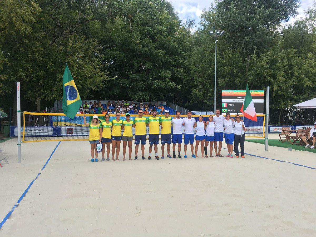 Brazil and Italy players line up at the start of their final ©ITF/Twitter
