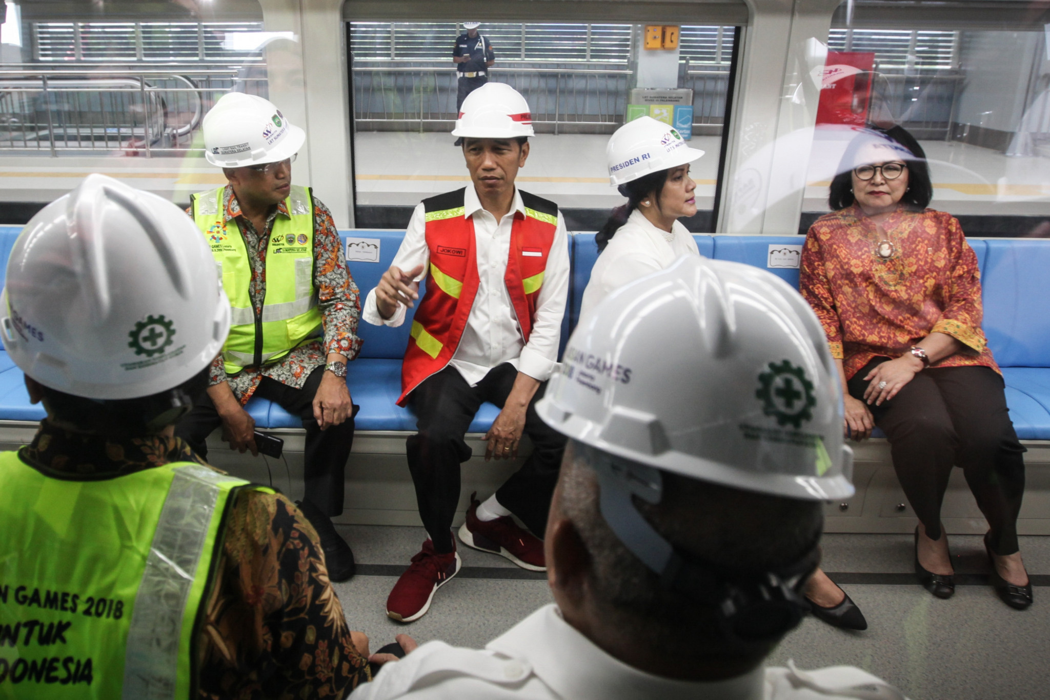 Indonesia's President Joko Widodo, second from left, sits inside a LRT rail car at Jakabaring station in Palembang ©Getty Images