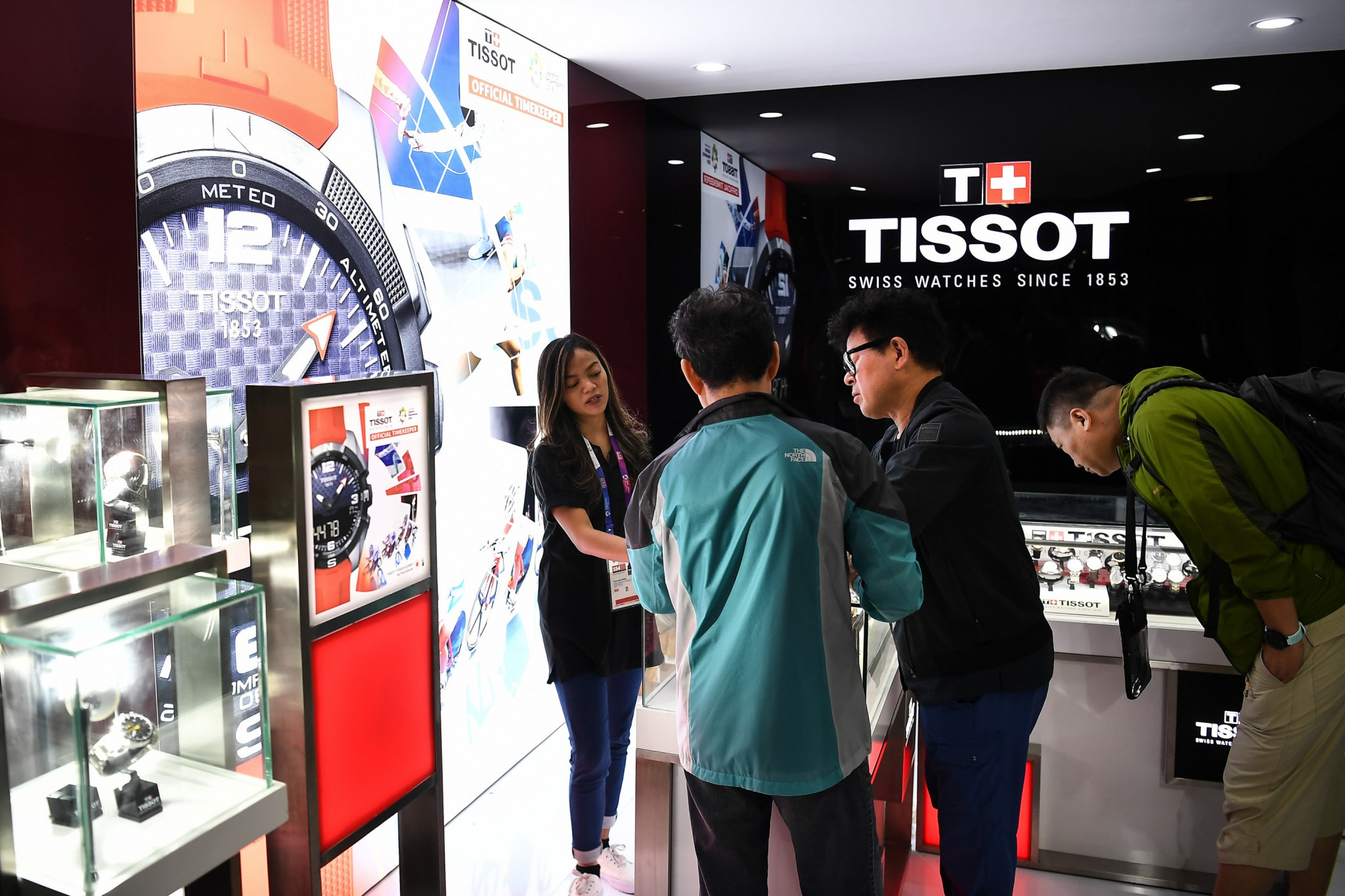Journalists take the opportunity to view a booth dedicated to Tissot, the official timekeeper of the Games, in the Main Press Centre ©Getty Images