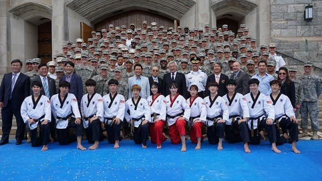 WTF President Chungwon Choue and members of the WTF taekwondo demonstration team post with cadets of the United States Military Academy