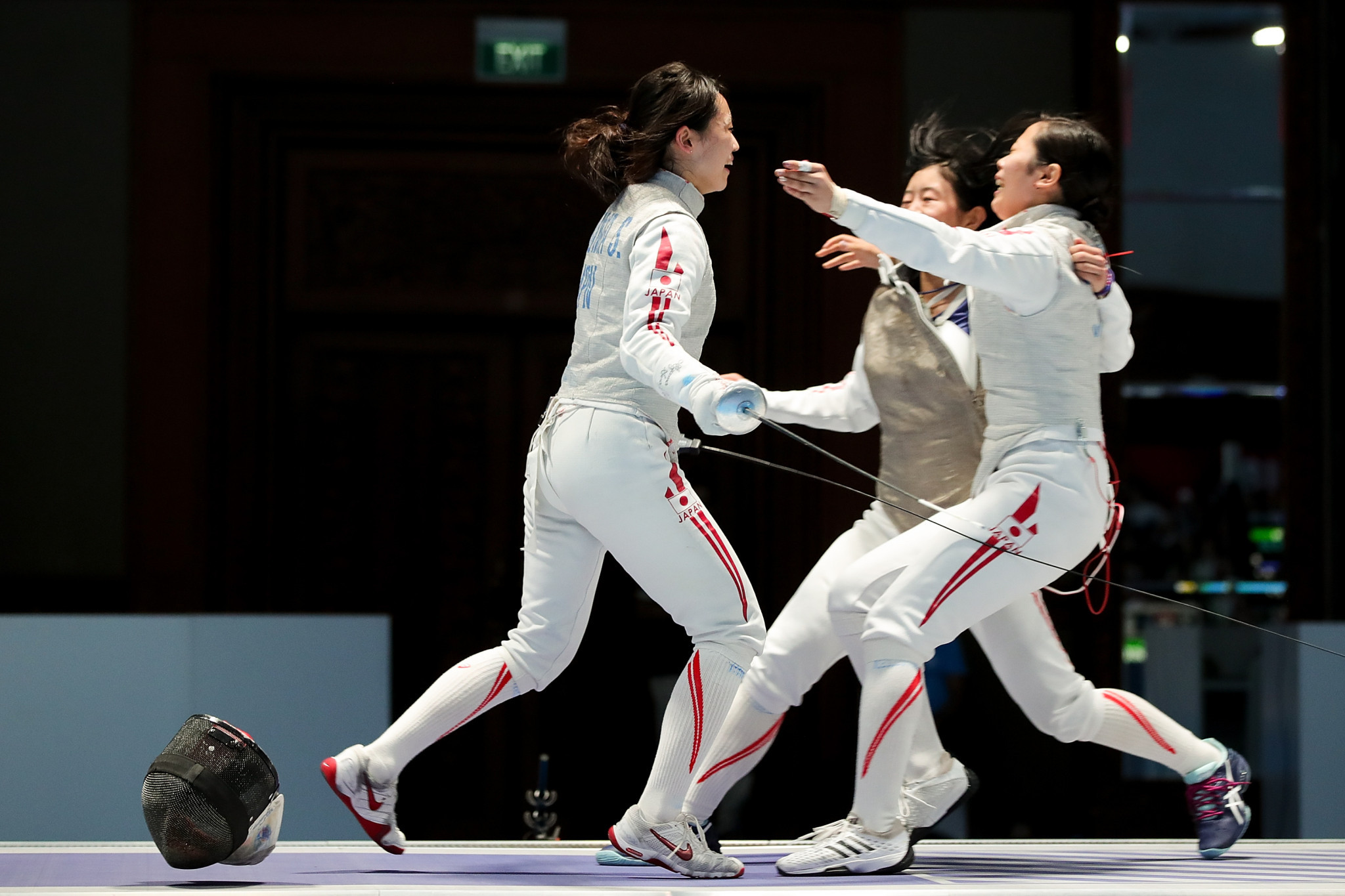 Japan's fencers celebrate after beating China in the women's team foil final ©Getty Images