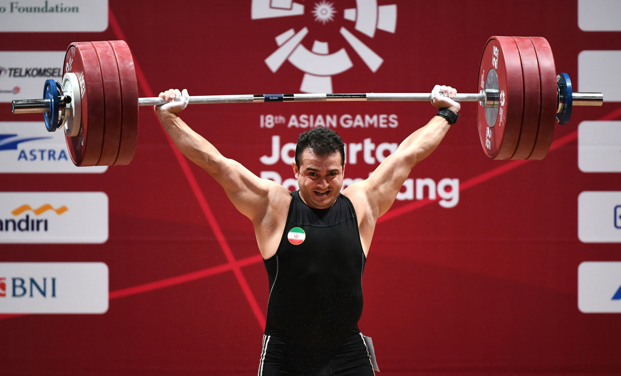 Iran's Sohrab Moradi broke a 19-year-old snatch world record on his way to winning the men's 94 kilograms weightlifting gold medal ©Getty Images