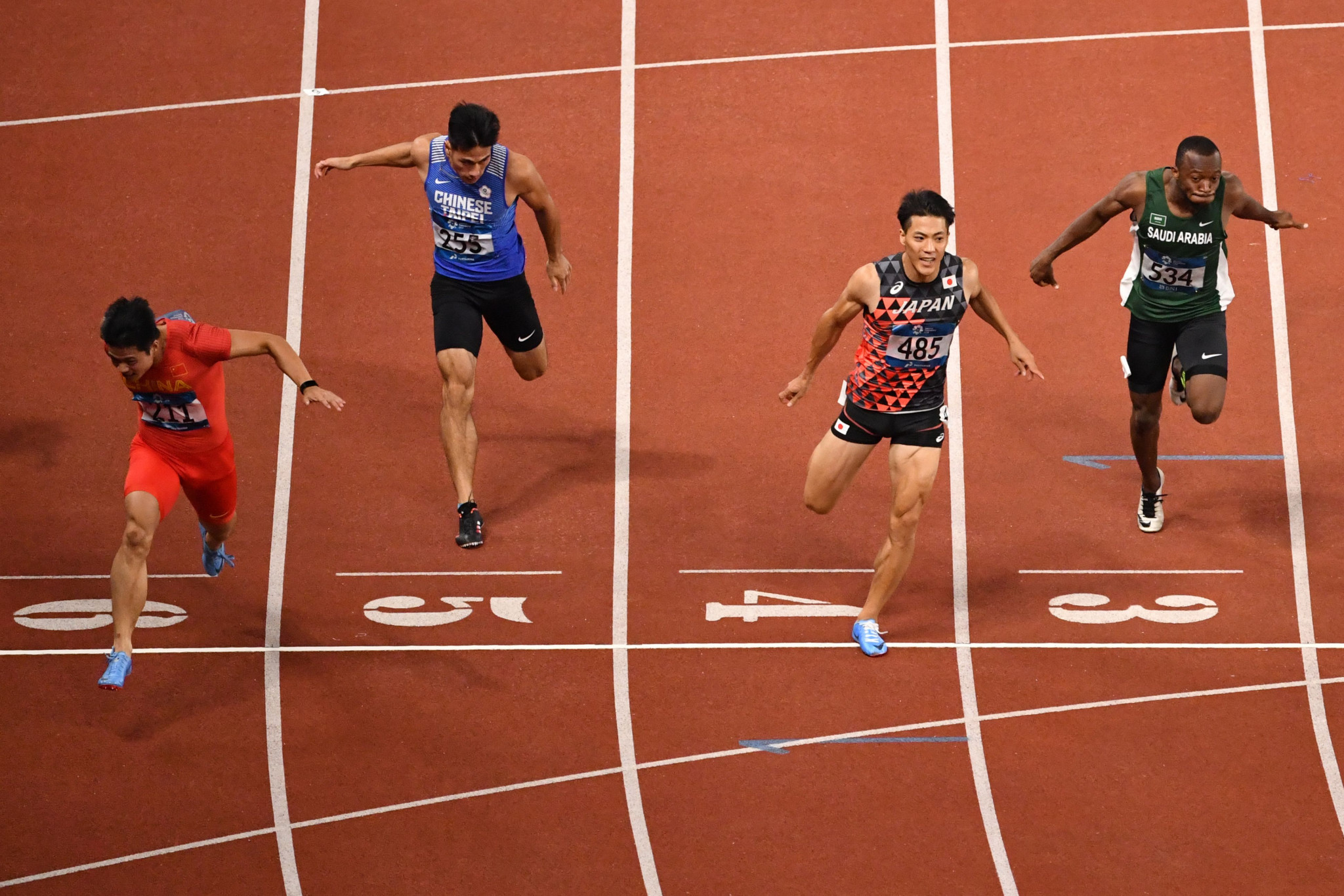 And ended with China's Su Bingtian, left, crossing the line first in the men's 100 metres in a Games record time of 9.92sec ©Getty Images
