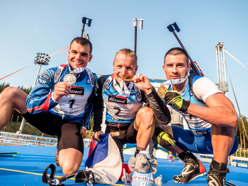 Home athletes Ondrej Moravec, centre, and Michal Krcmar, left, won gold and silver respectively in the men's pursuit at the IBU Summer World Championships in the Czech Republic, with Ukraine’s Artem Pryma third ©IBU 
