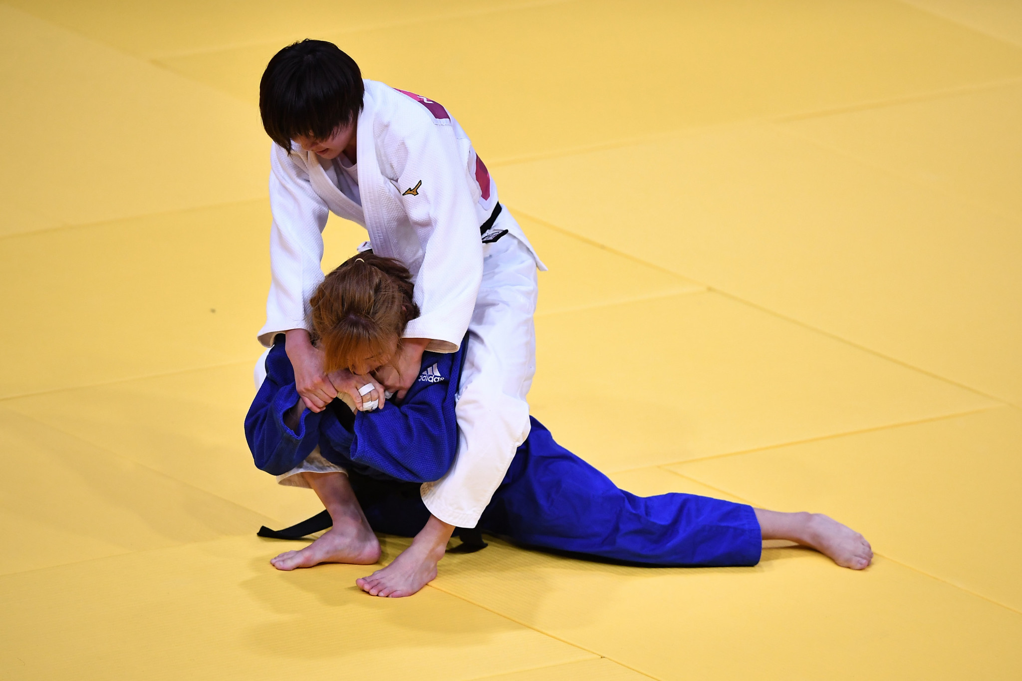 Natsumi Tsunoda, white, won one of four judo finals today, winning the women's under-52kg contest by ippon ©Getty Images