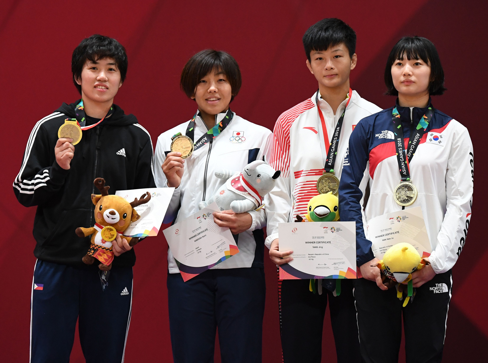 Nami Nabekura, second from left, was one of four judo gold medallists for Japan at the 2018 Asian Games today ©Getty Images