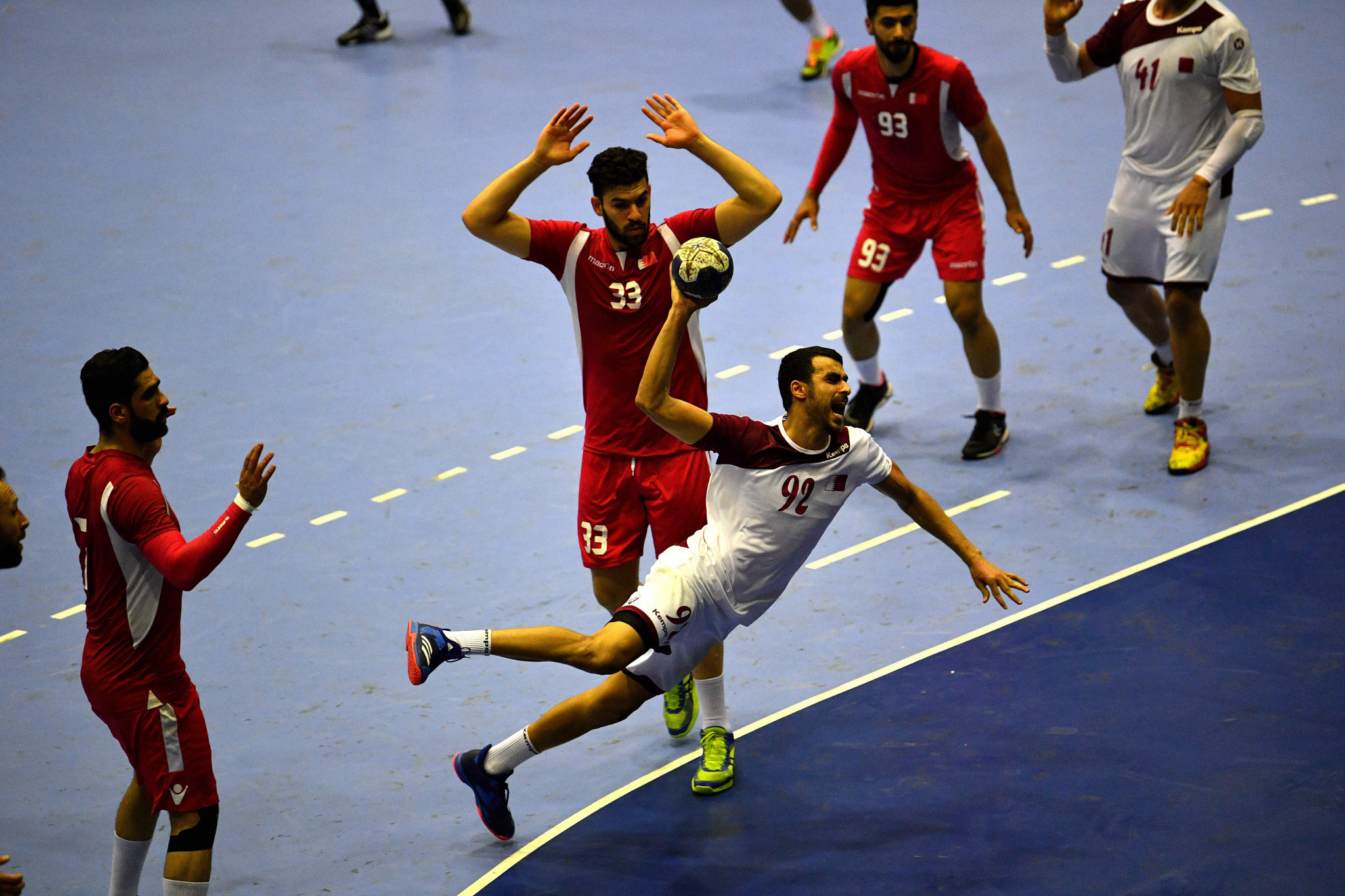 Defending champions Qatar, white, beat Bahrain in extra time to win the men's handball final ©Getty Images