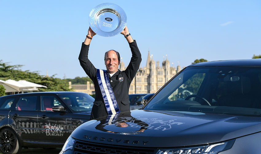 Tim Price holds the trophy for winning the Burghley Horse Trials ©Getty Images  