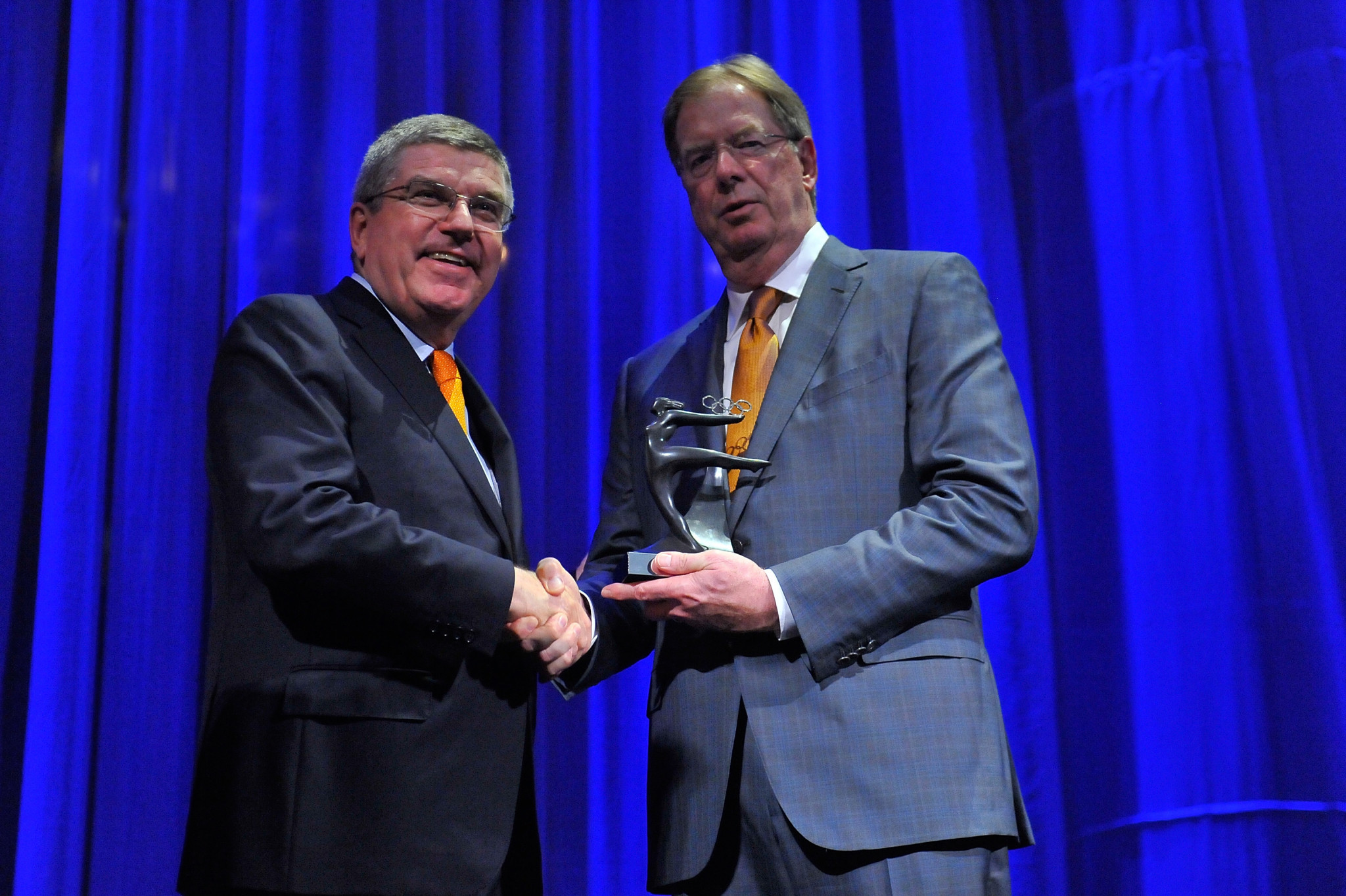 Larry Probst, right, with IOC President Thomas Bach ©Getty Images
