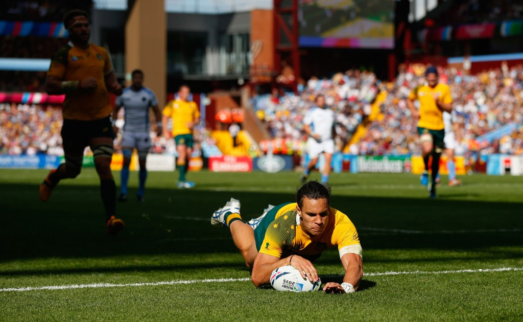 Matt Toomua goes over for a try in Australia's comfortable win over Uruguay