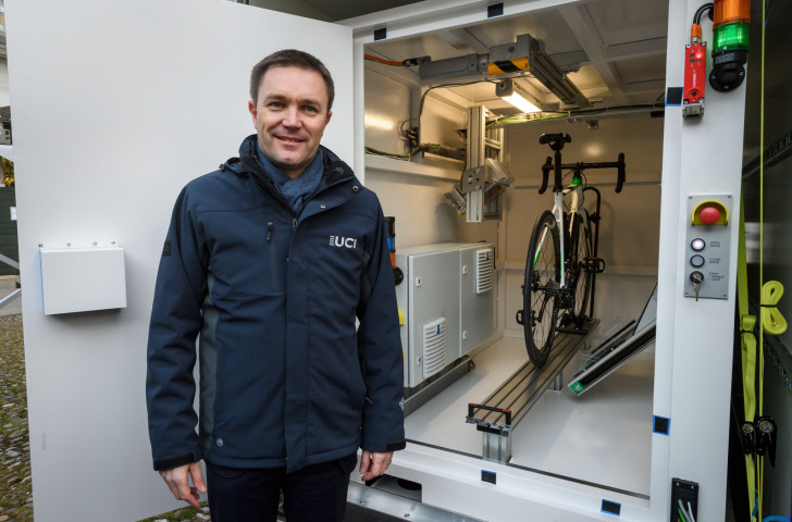 UCI President David Lappartient pictured in March in front of one of the new x-ray machines designed to detect technological cheating within bike frames ©Getty Images  