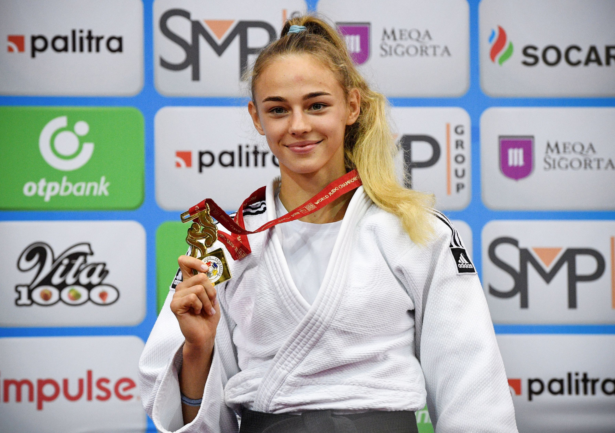 Daria Bilodid smiles with her first World Championship gold medal as she becomes the youngest judo world champion ©Getty Images