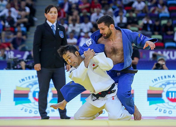 Takato of Japan won his third world title in Baku defeating Russia's Robert Mshvidobadze in the final ©IJF