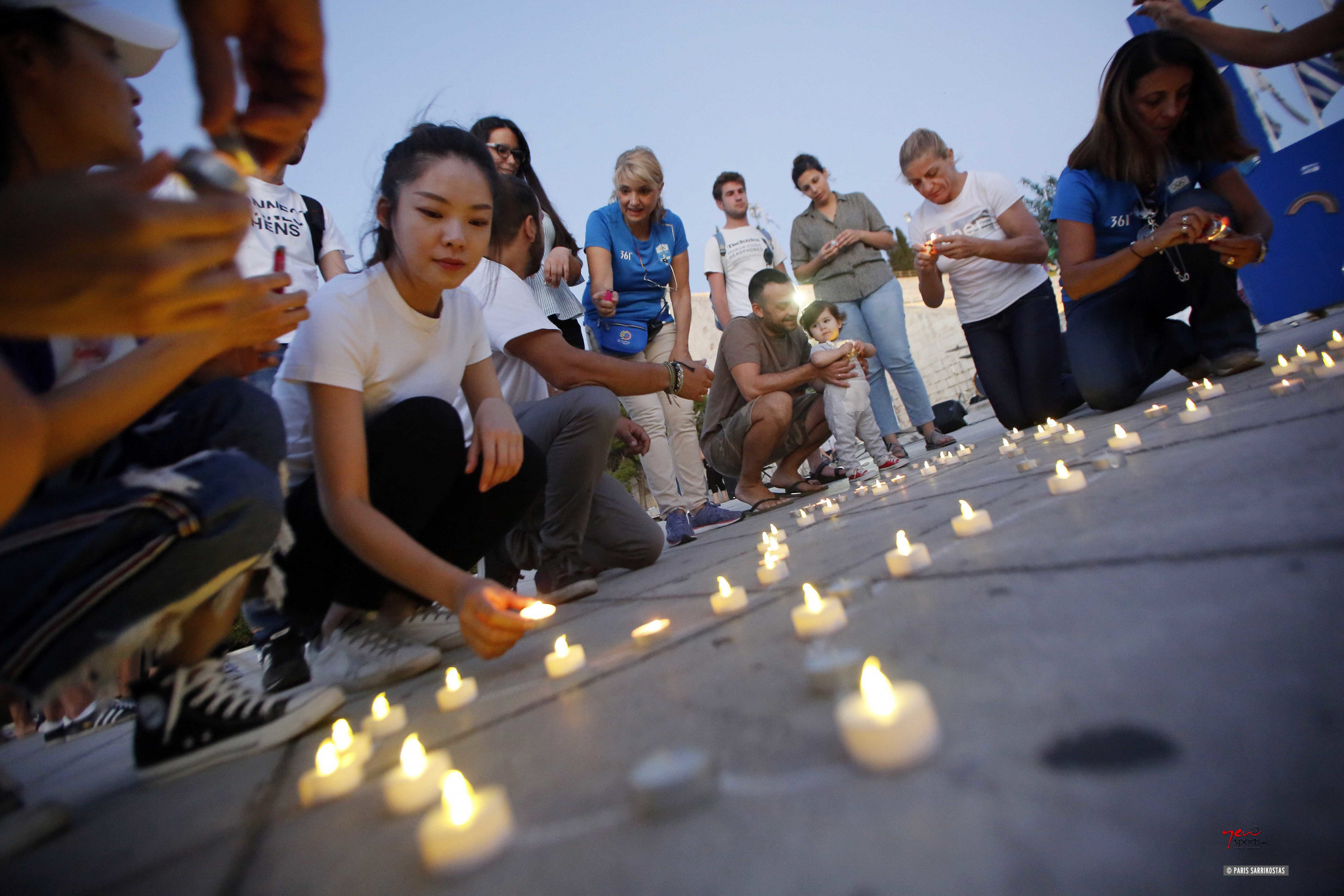 Schoolchildren and Olympians lit candles in the Panathenaic Stadium to mark the International Day of Peace ©HOC