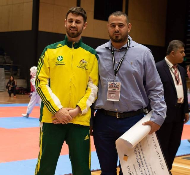 Steven Currie accepted the cheque on behalf of Australian Taekwondo ©DTP/Australian Taekwondo