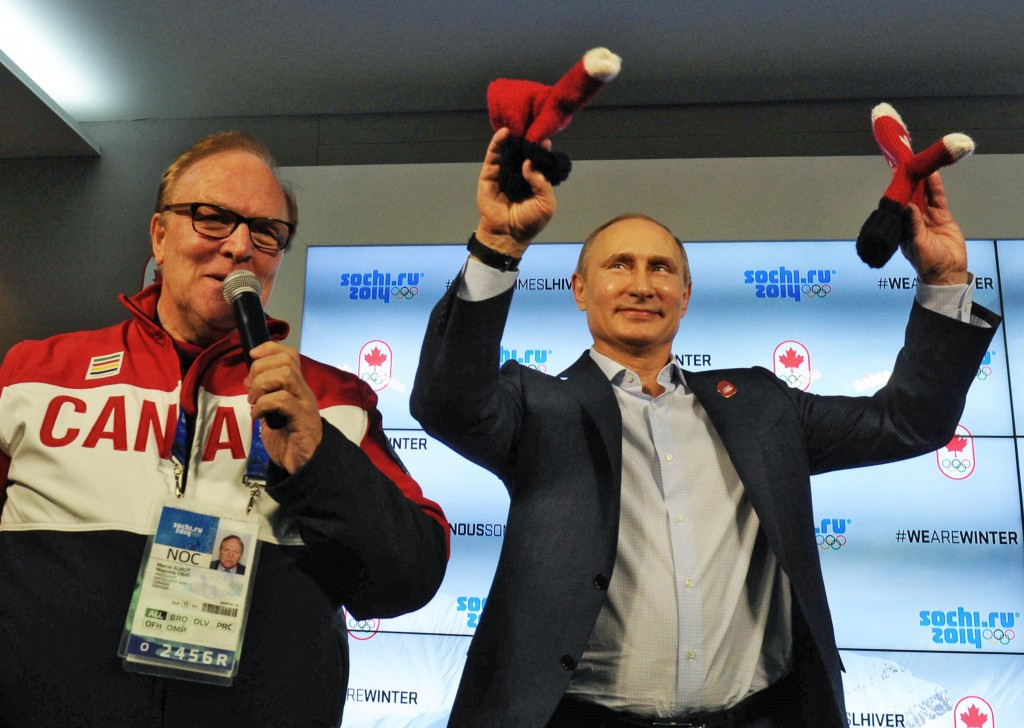 Marcel Aubut (left) pictured with Russian President Vladimir Putin during the Sochi 2014 Winter Olympics ©Getty Images