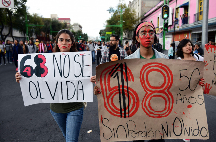 Demonstrators march to the Zocalo Square in Mexico City during the commemoration of the 50th anniversary of the 1968 Tlatelolco student massacre ©Getty Images  