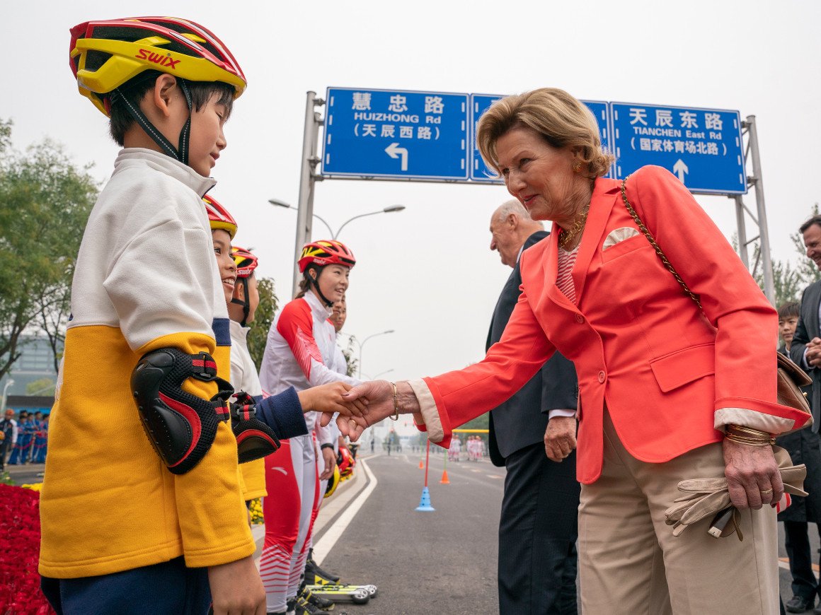 Norway's Queen Sonja shakes hands with young competitors after the special roller skiing event held in Beijing ©The Royal House of Norway