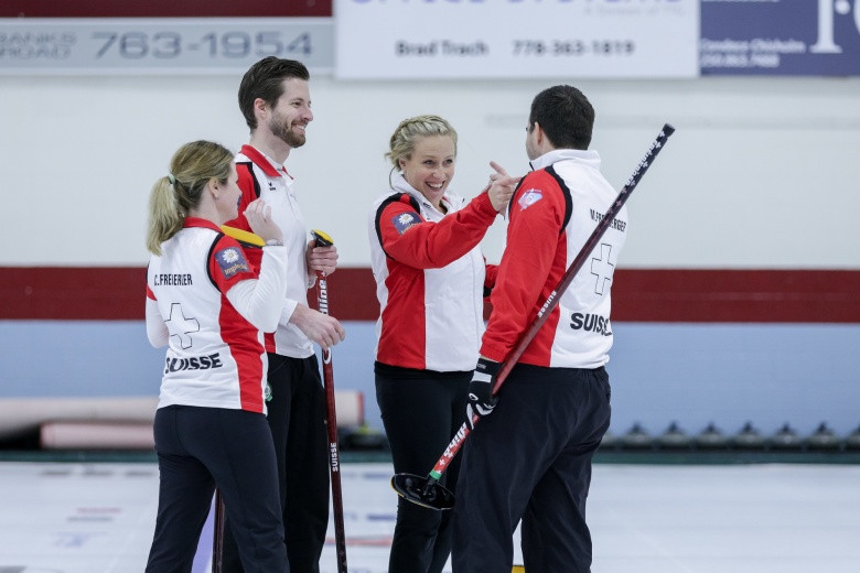 The Swiss curling team celebrate earning their place in the quarter-finals of the World Mixed Curling Championships in Canada after beating Slovenia ©WCF/Jeffrey Au
