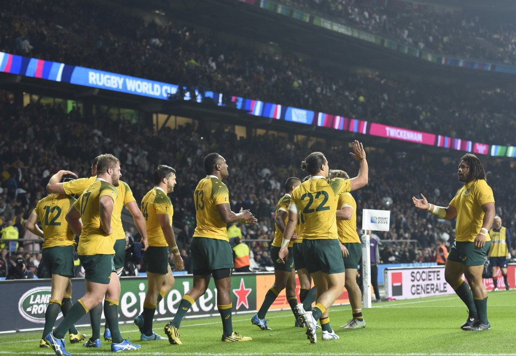 Australia celebrate after their stunning victory at Twickenham today ©AFP/Getty Images