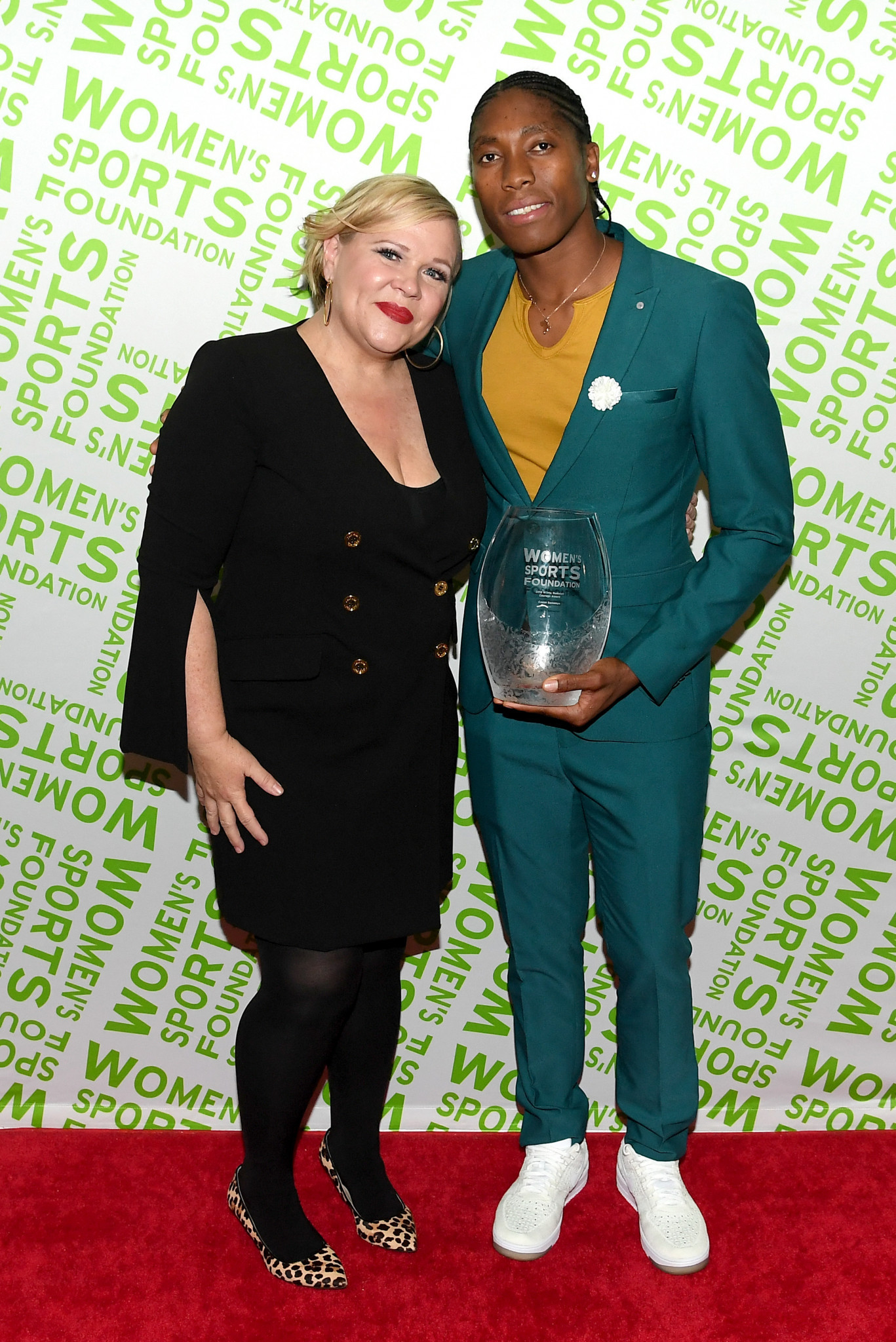 Caster Semenya, right, pictured with presenter Holly Rowe was presented with the Wilma Rudolph Courage Award at the Women’s Sports Foundation Annual Salute to Women in Sports ceremony ©Getty Images 