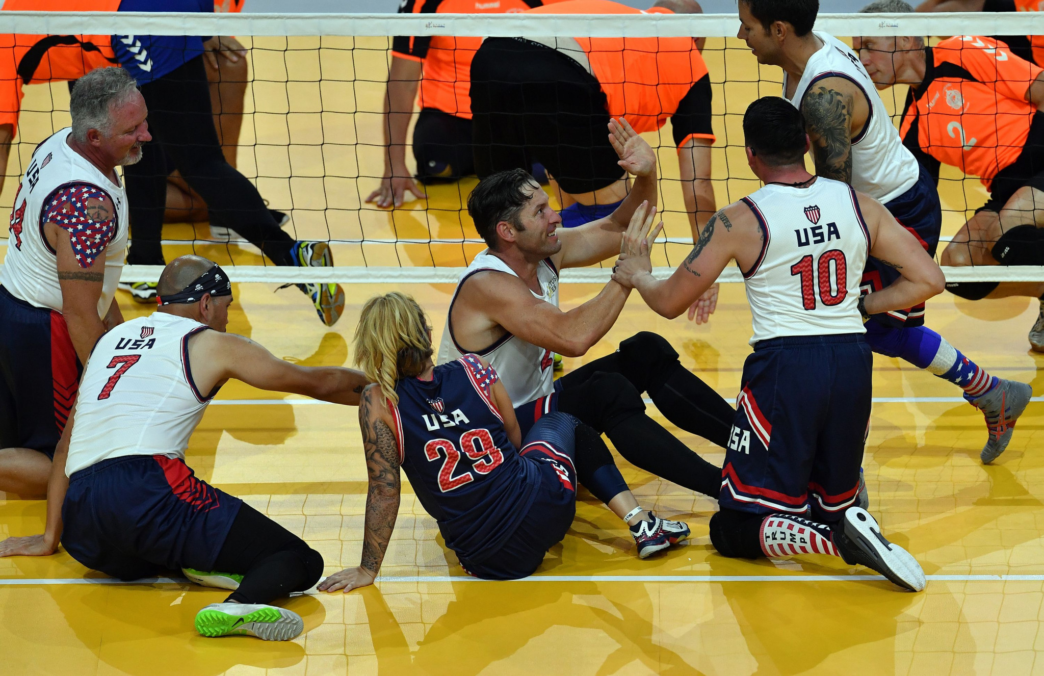 America's sitting volleyball team celebrate beating New Zealand 21-17, 21-6 at the Invictus Games in Sydney ©Getty Images 