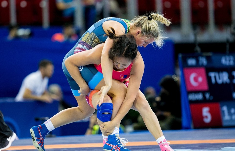 Zsanett Nemeth from Hungary, top, lost in the semi-finals of the 76kg division but could still win the host's first medal tomorrow when she wrestles for bronze ©UWW