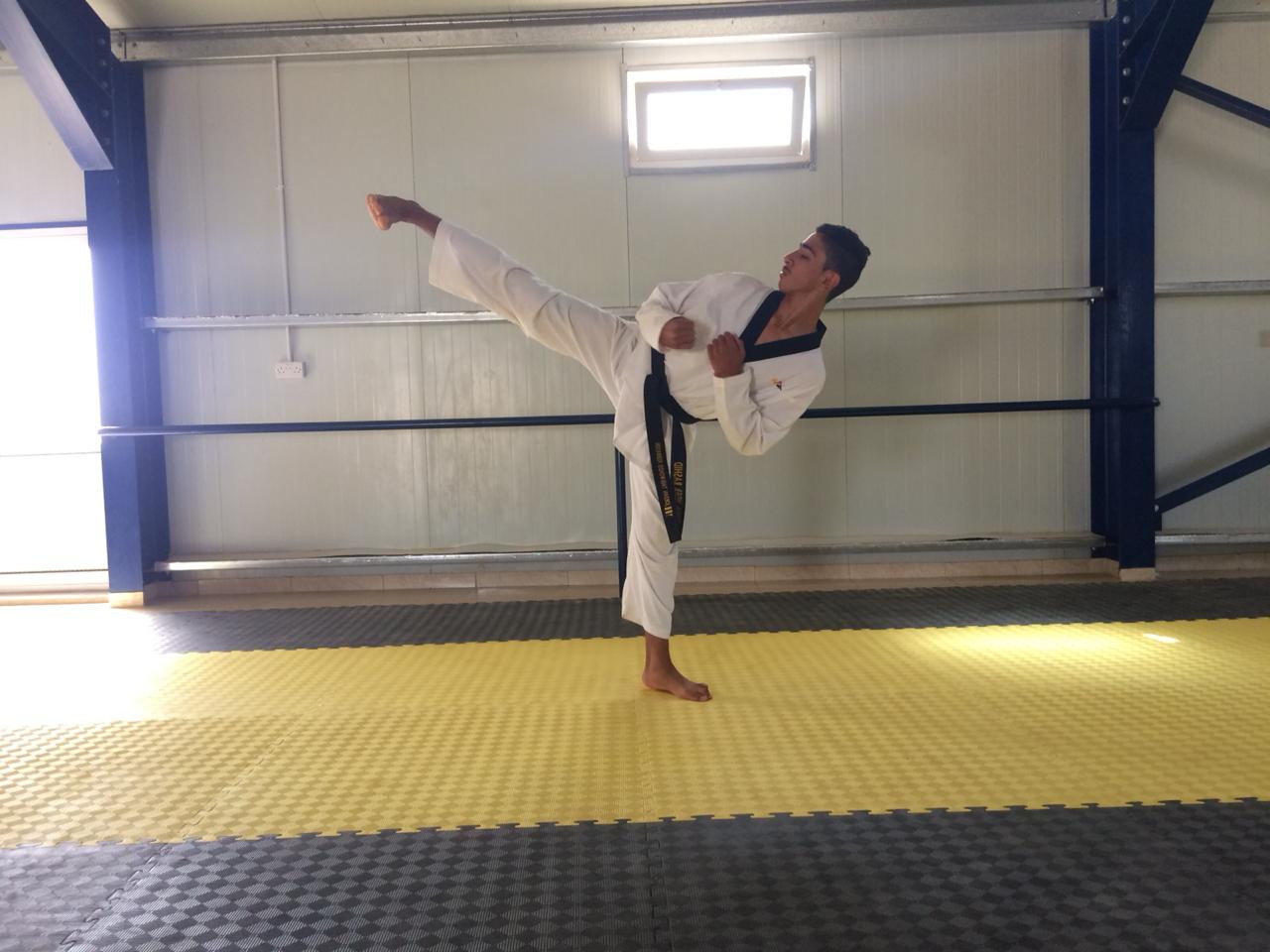 Second refugee achieves black belt at Taekwondo Humanitarian Foundation Academy