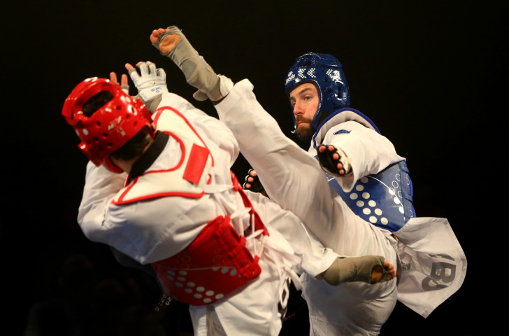 Damon Sansum, right, en-route to silver in the men's under 80kg category at the World Taekwondo Grand Prix in Manchester, where the hosts equalled their record medal haul ©Getty Images  