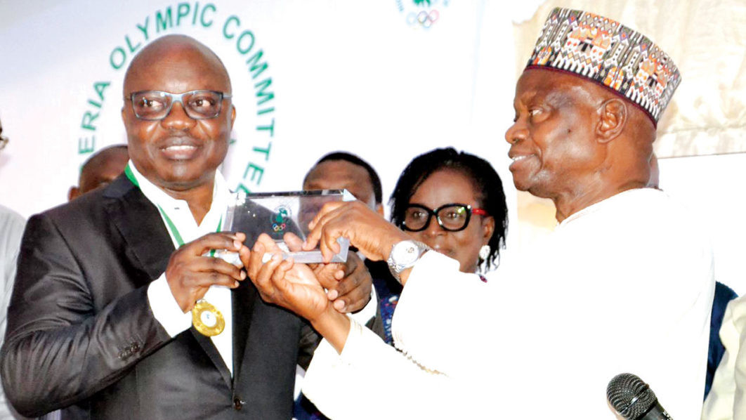 Nigeria Olympic Committee President Habu Gumel, right, swears in a new patron during a special ceremony in Lagos ©Twitter