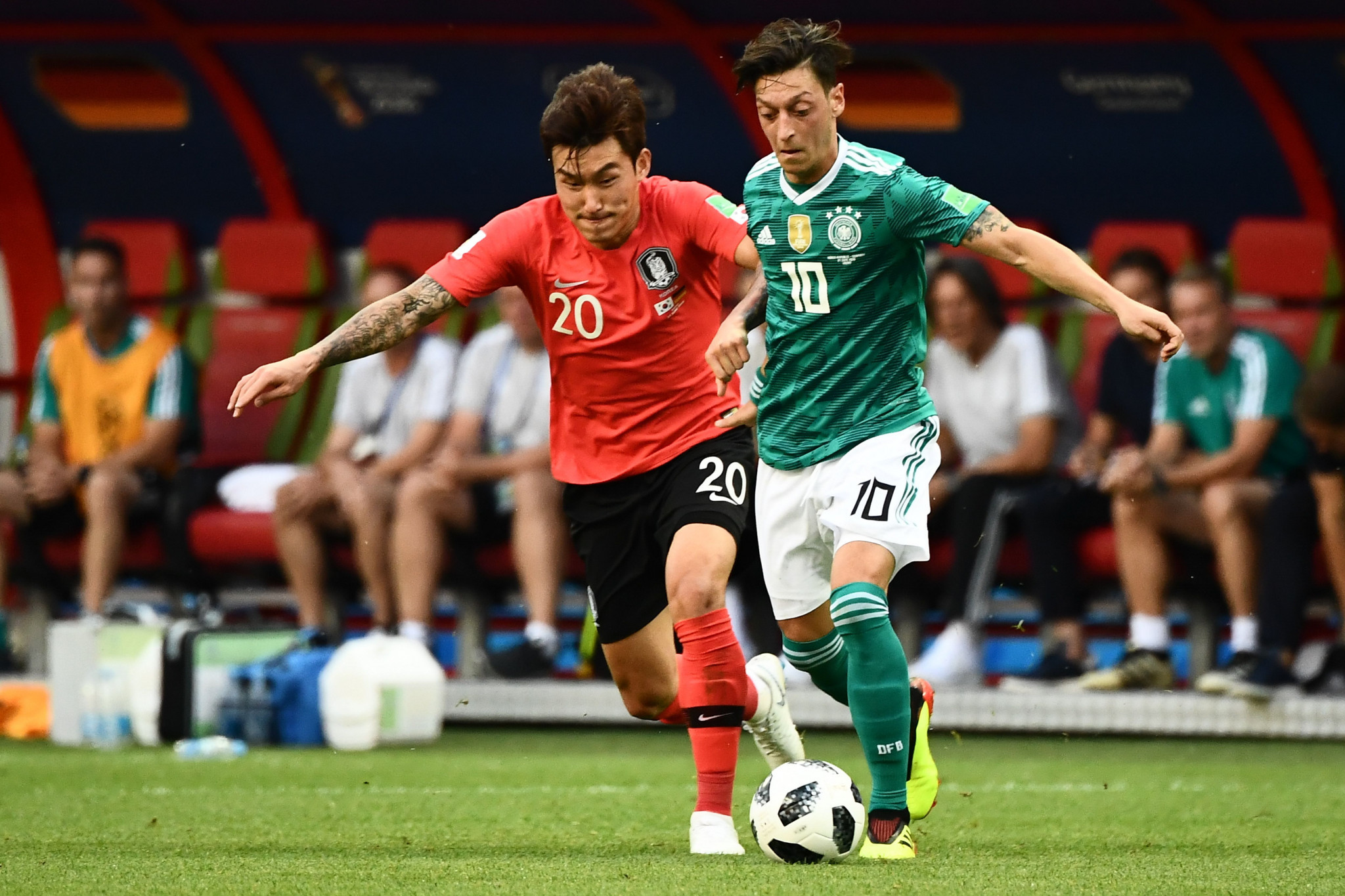 South Korea's defender Jang hyun-soo, pictured left with Germany's Mesut Ozil at this year's World Cup finals, has been banned for life from the national team for lying over his community service record ©Getty Images  
