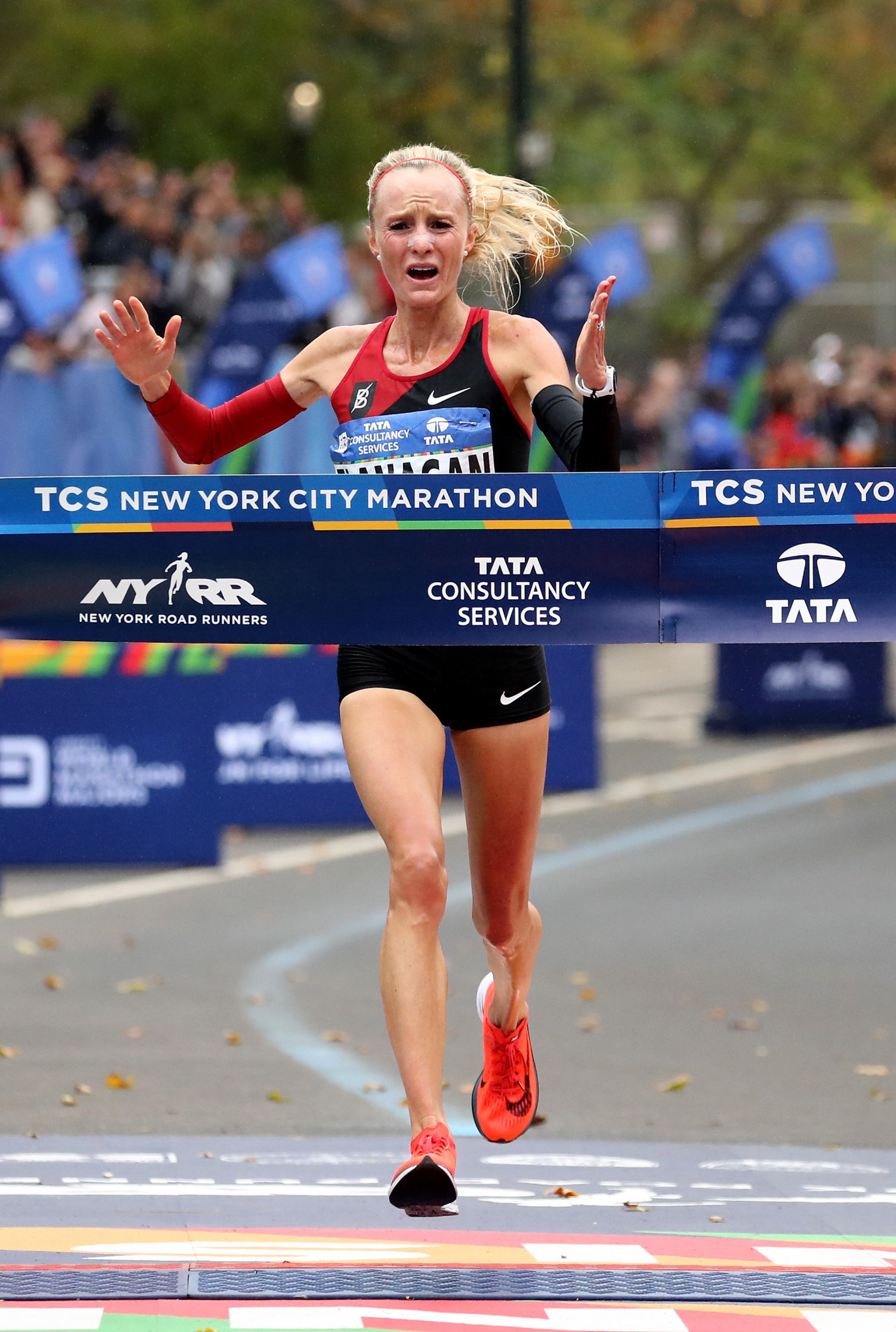 Home athlete Shalane Flanagan, pictured winning the New York marathon last year, will defend her title tomorrow ©Getty Images  