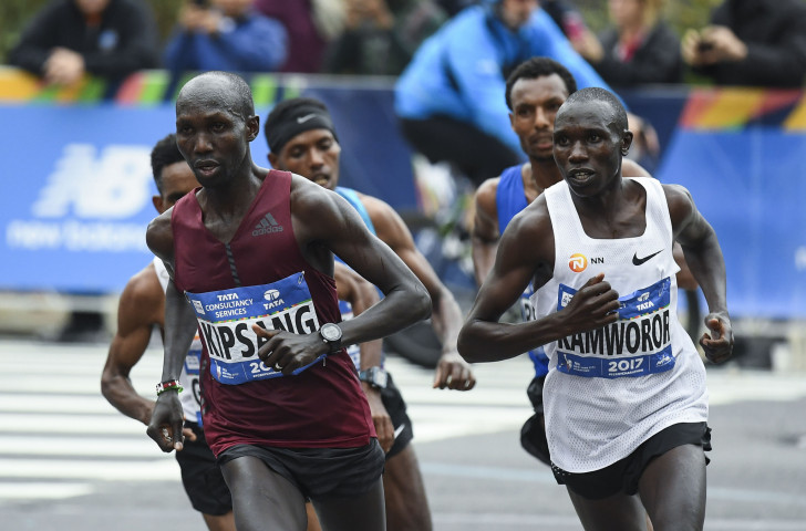 Kenya's Geoffrey Kamworor, pictured right en route to winning last year's New York marathon, is strongly fancied to make a successful defence tomorrow ©Getty Images  