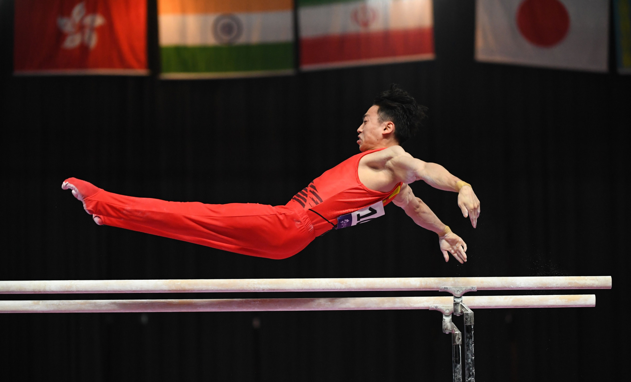 Zou Jingyuan of China produced a near-perfect routine to claim parallel bars gold ©Getty Images