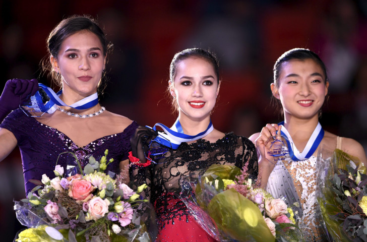 Silver medalist Stanislava Konstantinova, left,  and gold medalist Alina Zagitova, both of Russia, and bronze medalist Kaori Sakamoto of Japan pose on the podium after the women's competition ©Getty Images  