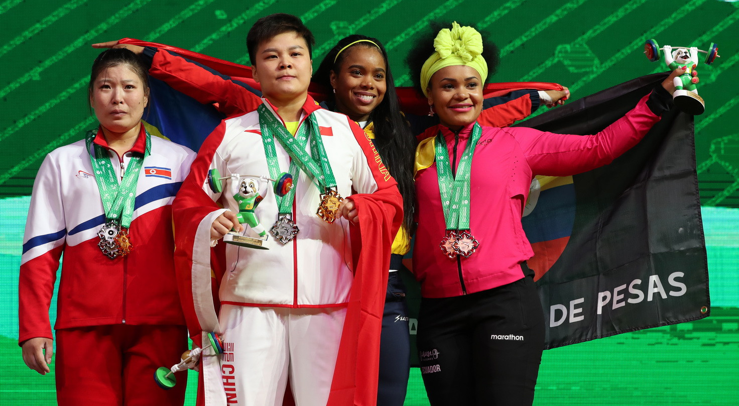 Colombia's Leidy Yessenia Solis Arboleda, second from right, completed the list of medallists by finishing third in the clean and jerk ©IWF