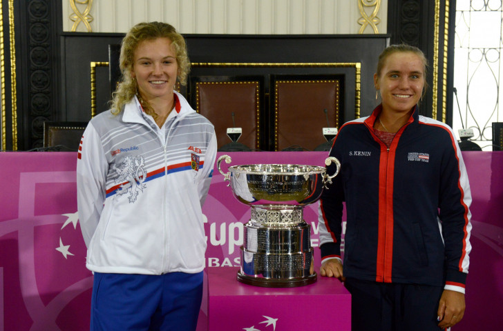 Czech Republic's Katerina Siniakova, left, and Sofia Kenin of the United States pose with the trophy after a draw ceremony for the  Fed Cup that starts in Prague tomorrow ©Getty Images  