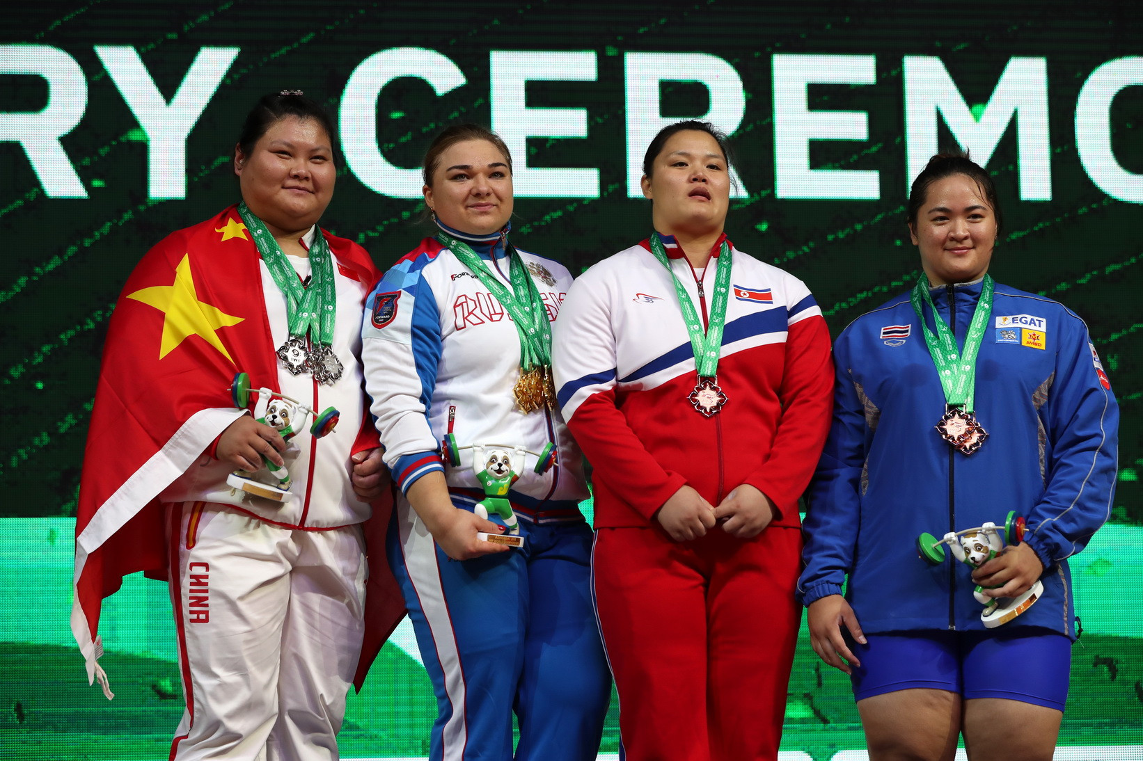 North Korea's Kim Kuk Hyang, second from left, completed the list of podium finishers having come third in the snatch ©IWF