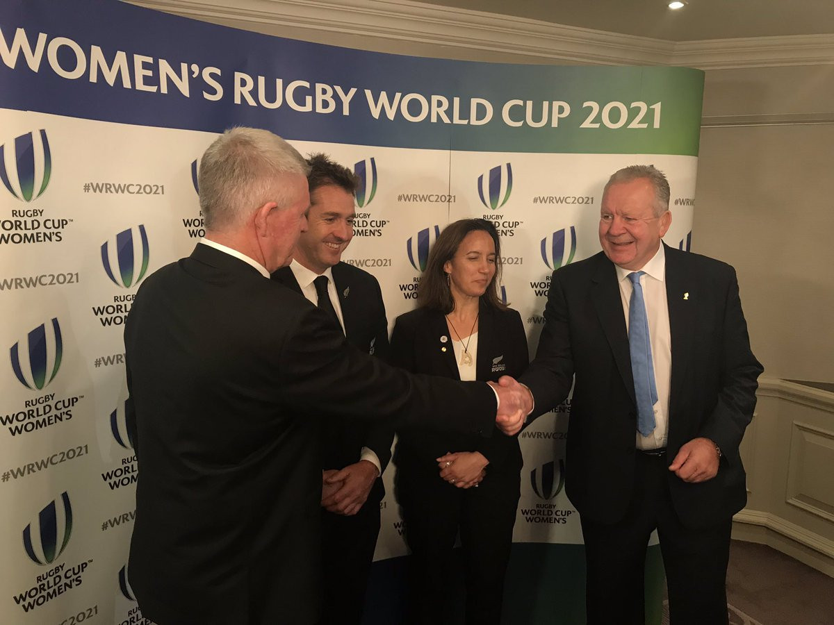 World Rugby chairman Bill Beaumont, right, congratulates the New Zealand delegation after they had been awarded the 2021 Women's Rugby World Cup ©Twitter